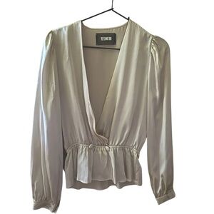 NWT Reformation silk plunge-line blouse with silk covered buttons.